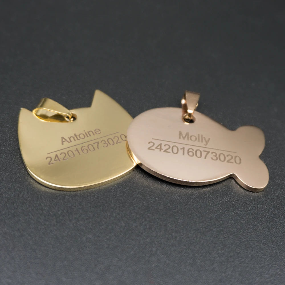 Engraved metal pet ID tags in bone, cat and fish shapes